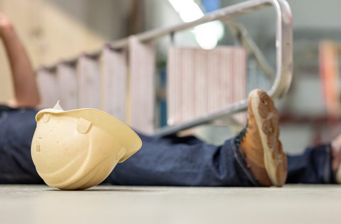 Male-worker-lying-on-the-floor-after-fall-accident