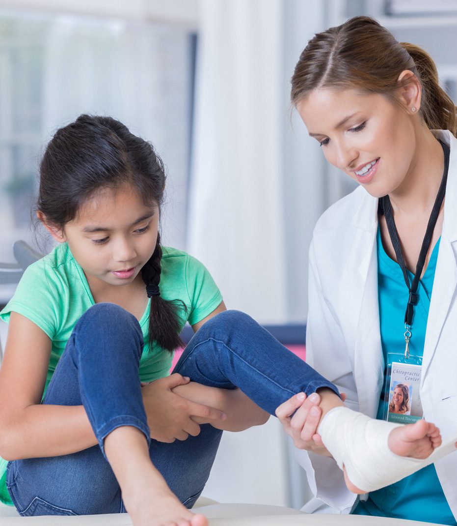 Doctor-treating-child-with-injuries-from-property-hazard