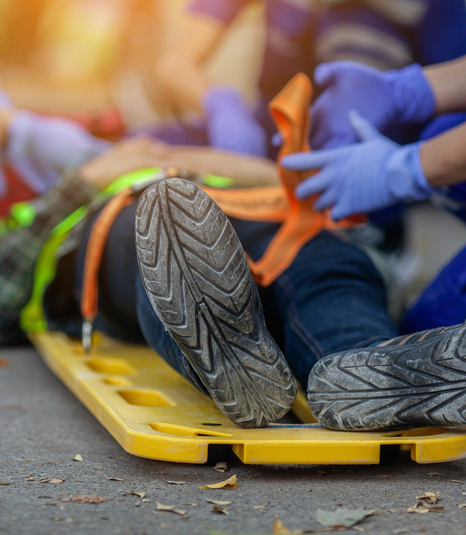 Paramedics-treating-employee-after-workplace-accident