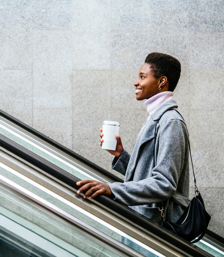 Woman-riding-an-escalator