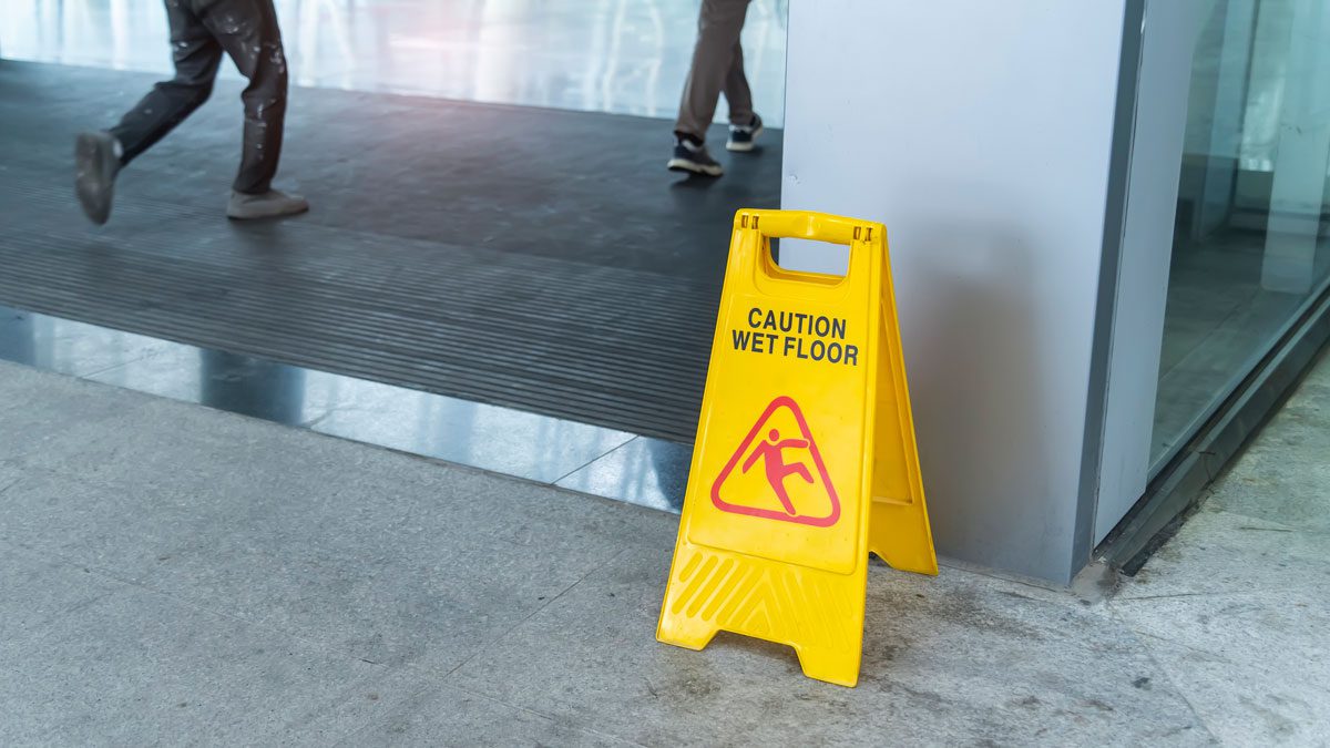 Caution wet floor sign on indoor walkway
