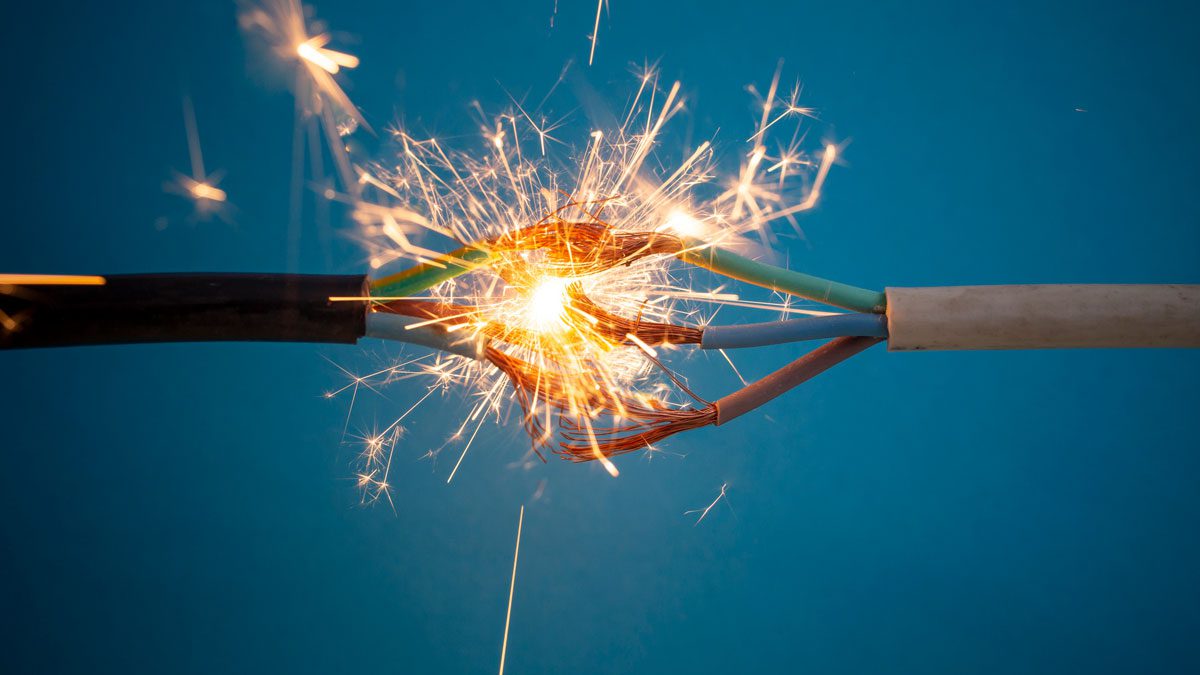 Exposed electrical wires sparking and creating dangerous short circuit