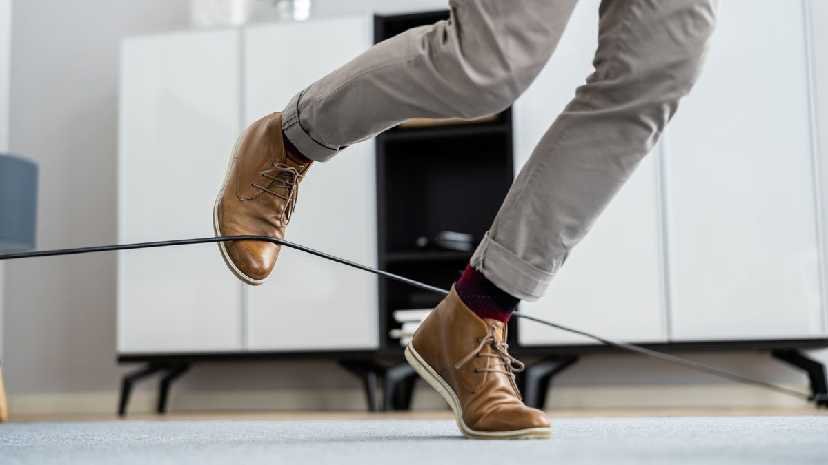 Feet-tripping-over-electrical-cord