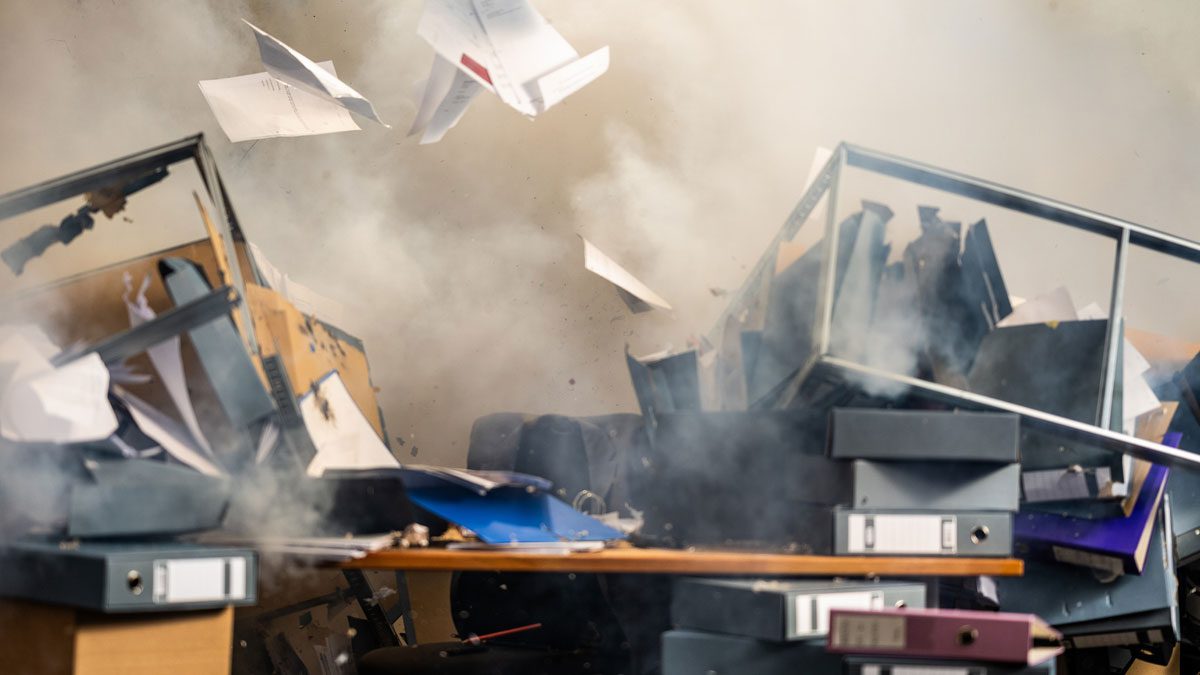 Office-explosion-scene-with-debris-flying-and-equipment-damaged