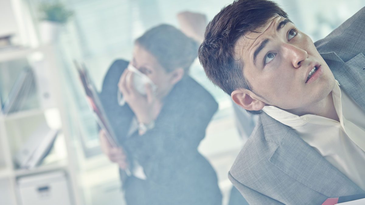 Office workers reacting to smoke filled environment