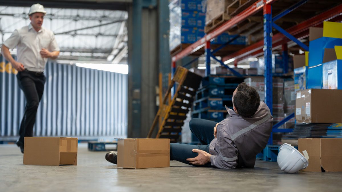 Warehouse worker injured on floor as colleague runs over